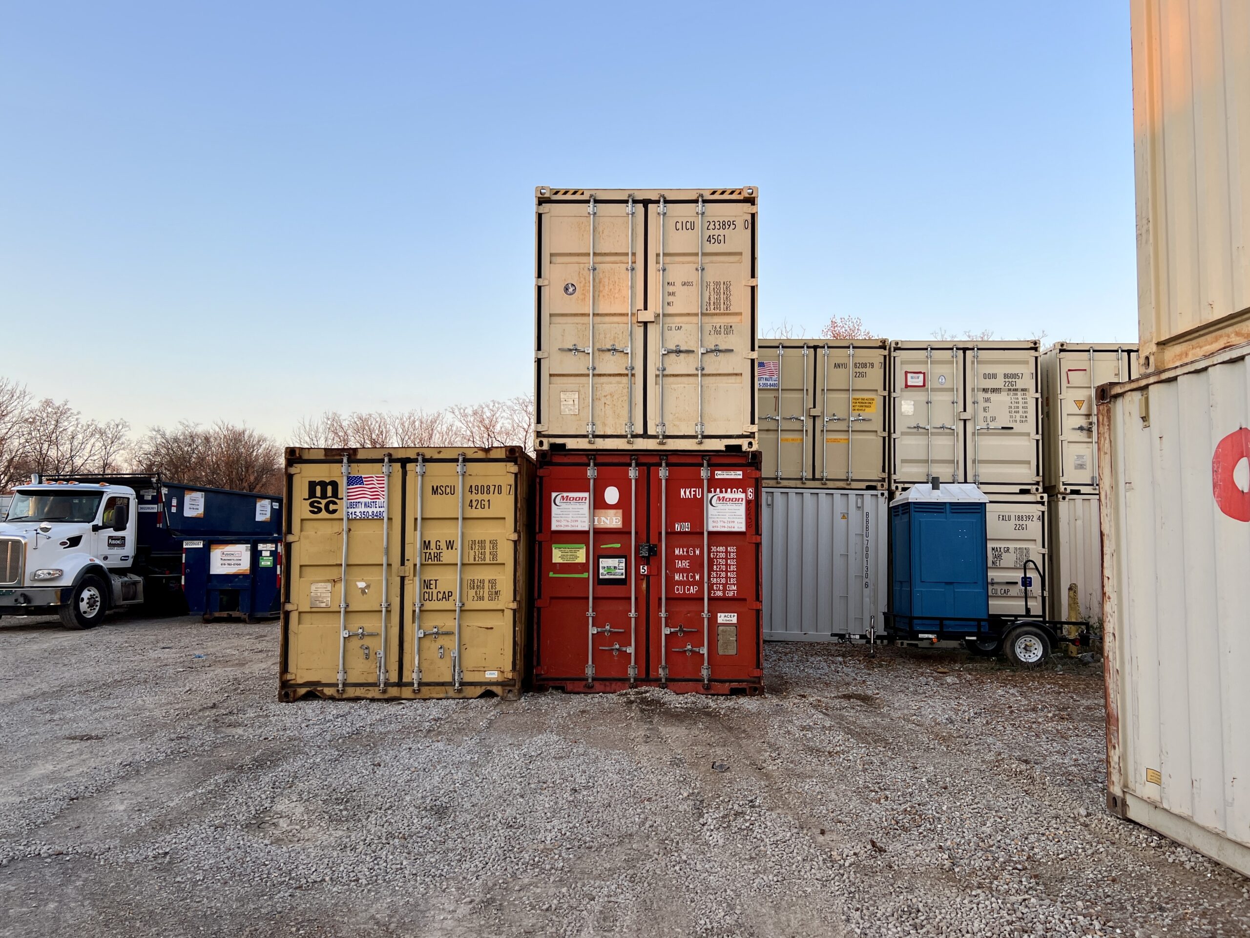Close-up of storage container doors with locking bars and secure latch for portable storage.