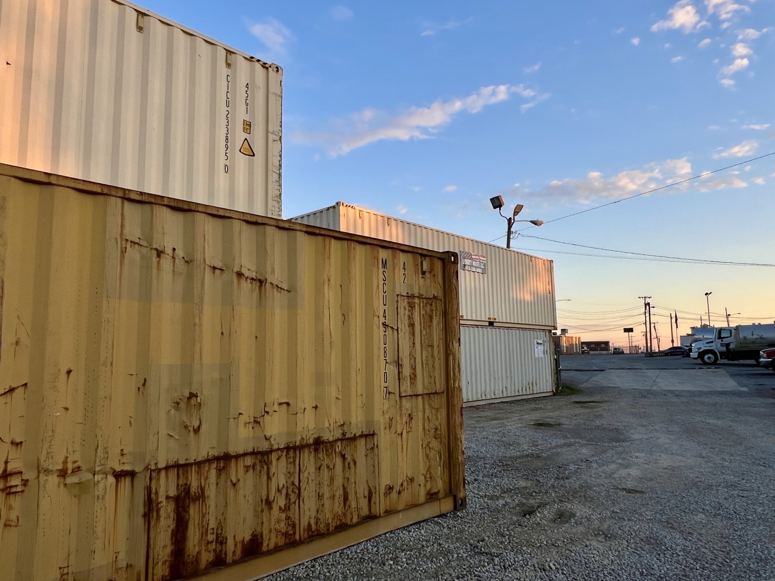 Interior of a shipping container rental with corrugated steel walls and wood flooring.