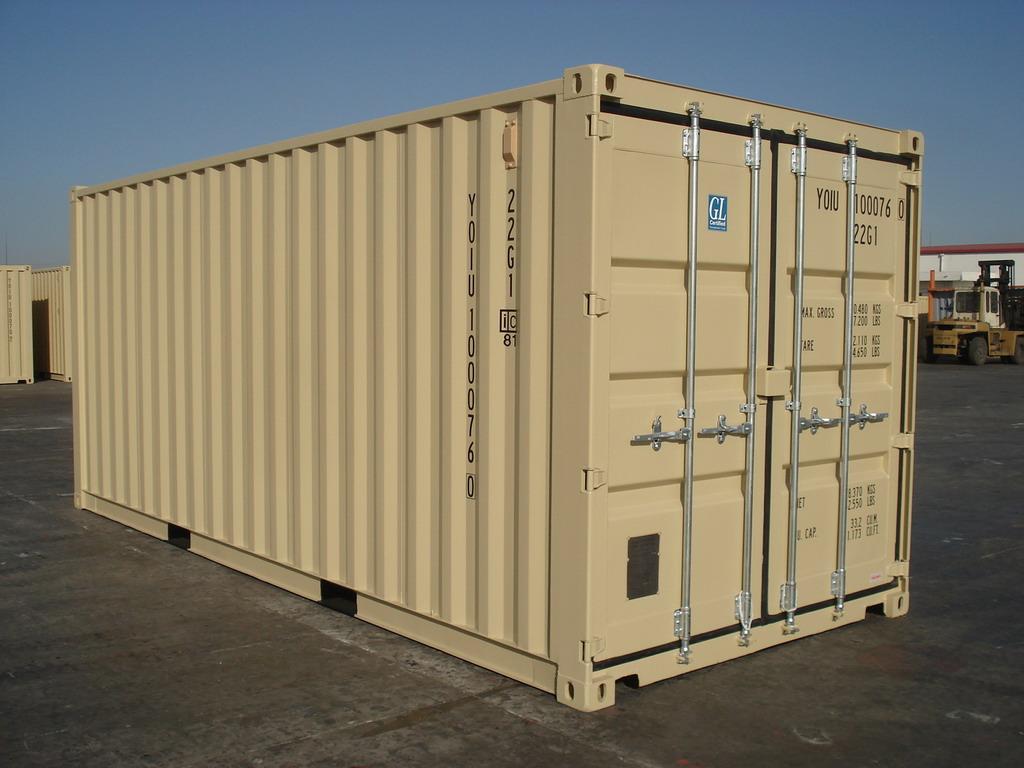 20-foot light gray shipping container with closed corrugated steel doors and locking bars, sitting on a gravel surface in an outdoor storage yard.