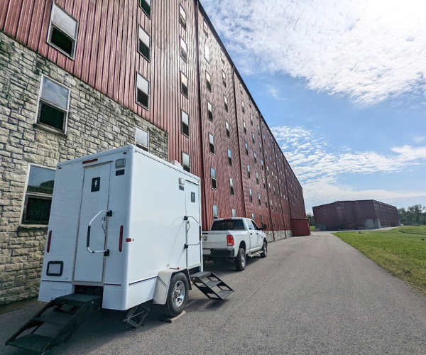 Restroom trailer rental graphic—multi-stall portable bathroom for events and job sites.