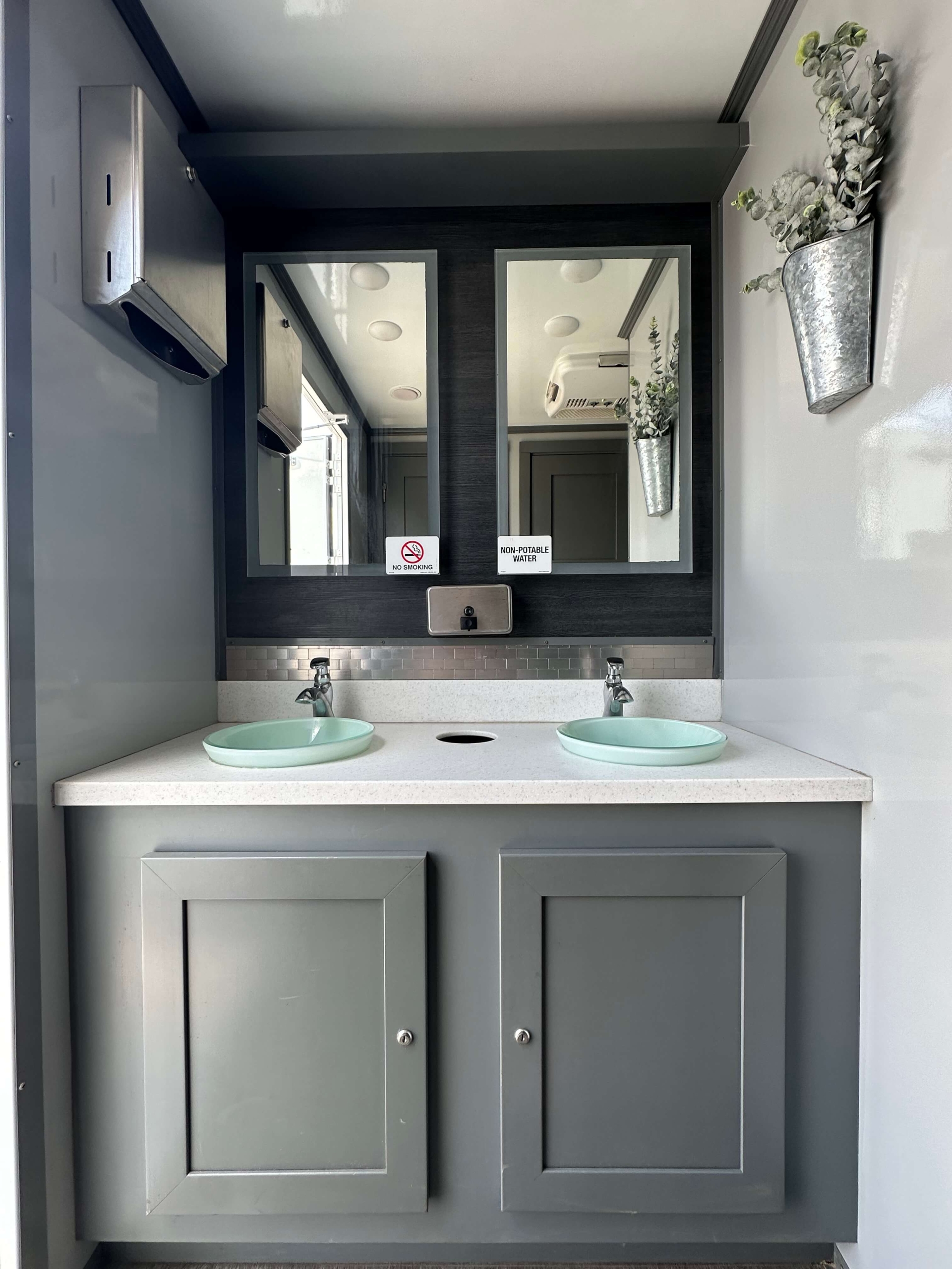 Restroom trailer rental providing clean, comfortable facilities with ventilation and lighting.