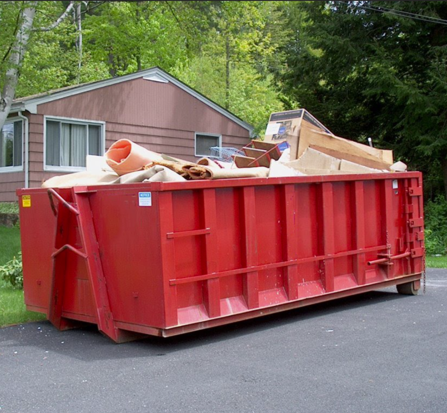 Roll-off dumpster with open-top steel bin for construction debris and cleanouts.