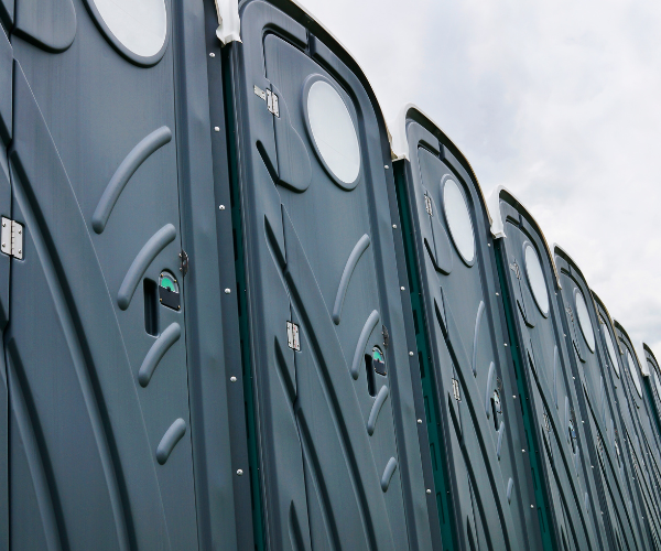 Portable toilet exterior—weather-resistant shell with vented roof.