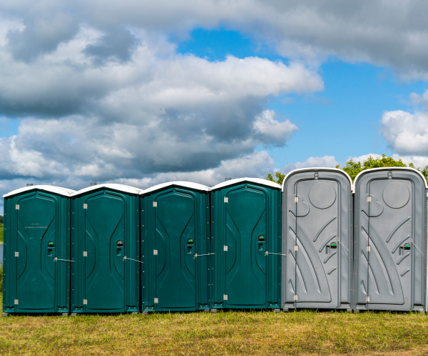 Portable restroom cabinet showing durable walls and in-use indicator lock.