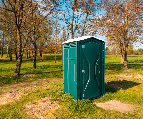 Single-unit portable toilet with vent stack and secure latch for outdoor events.